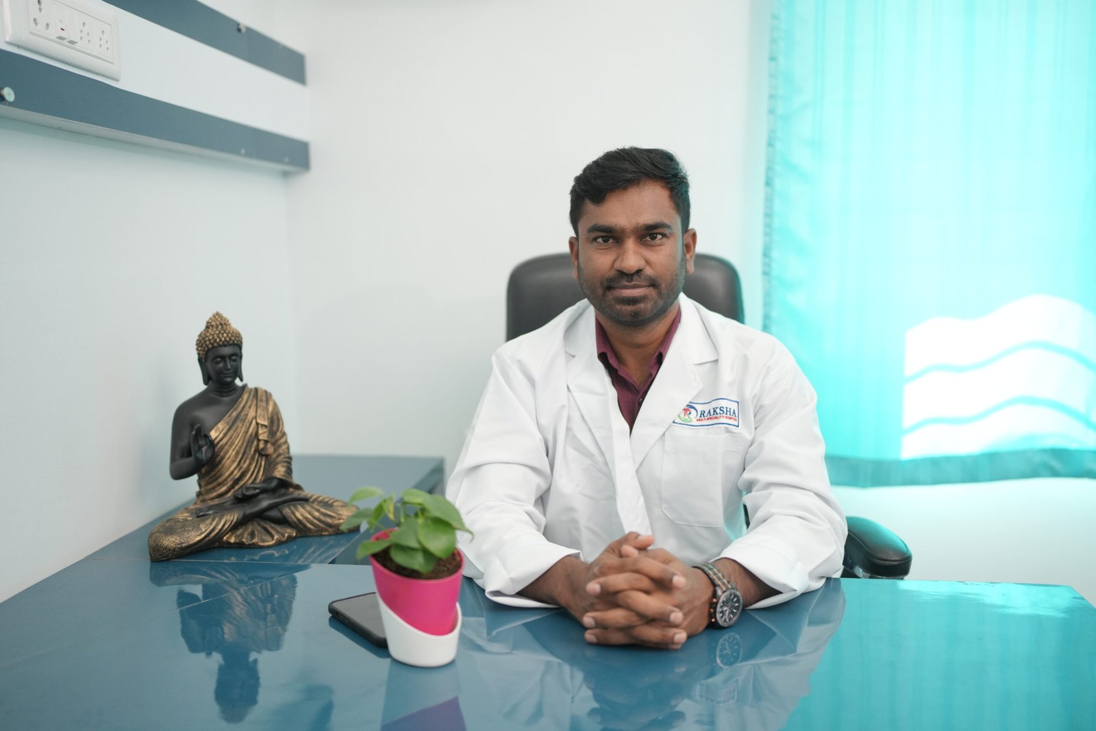 Dr. Nandakum M